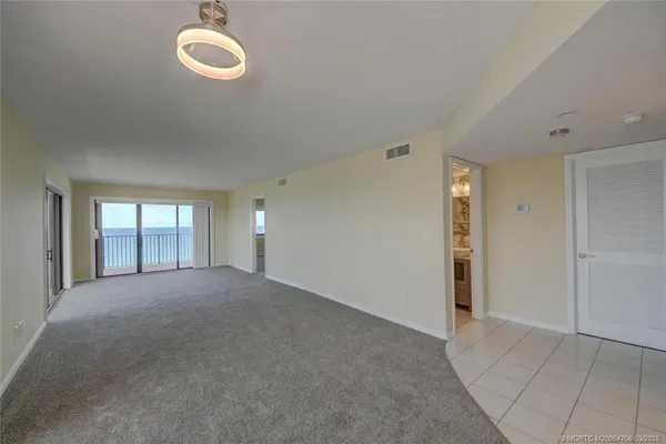 a view of empty room with windows