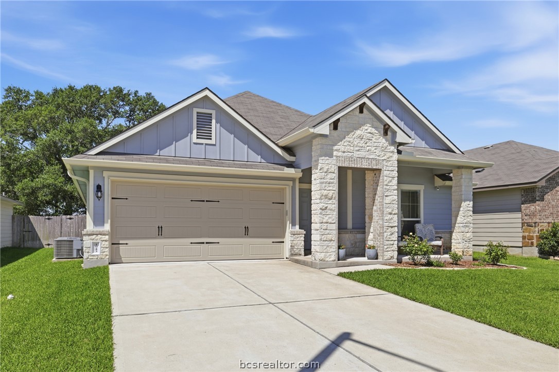 1943 Thorndyke Lane Bryan, TX 77807 - Photo 2 of 28 Front of home! Two car garage, long driveway, and front porch to relax on!
