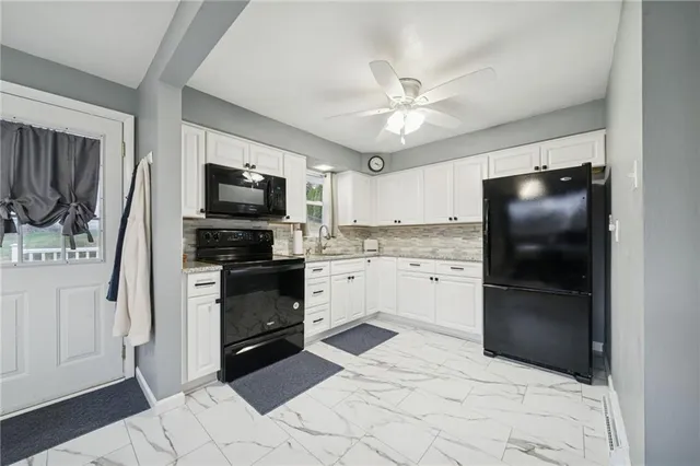 a kitchen with a refrigerator stove and microwave