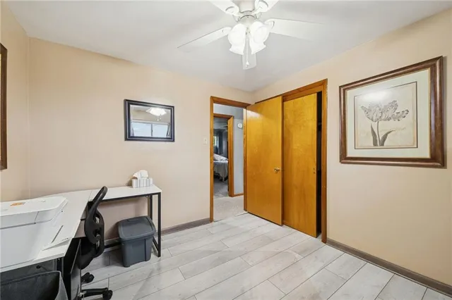 a large bedroom with a bed and a flat screen tv