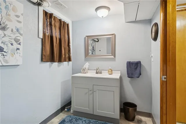 a view of a deck with yard and ocean view