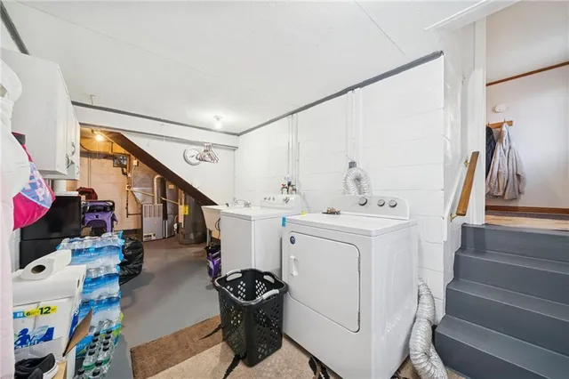 a kitchen with sink cabinets and a refrigerator