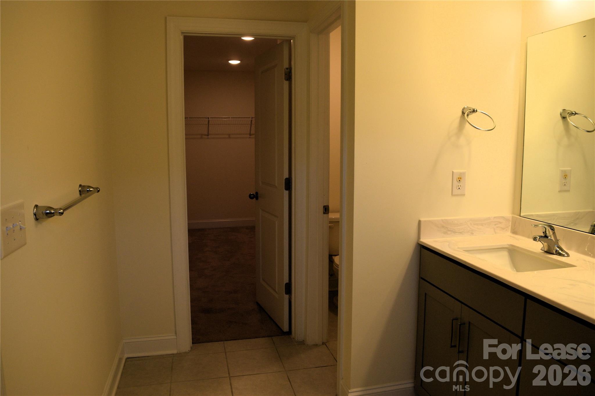 4011 Rothwood Lane Harrisburg, NC 28075 - Photo 16 of 29 a bathroom with a sink and a mirror
