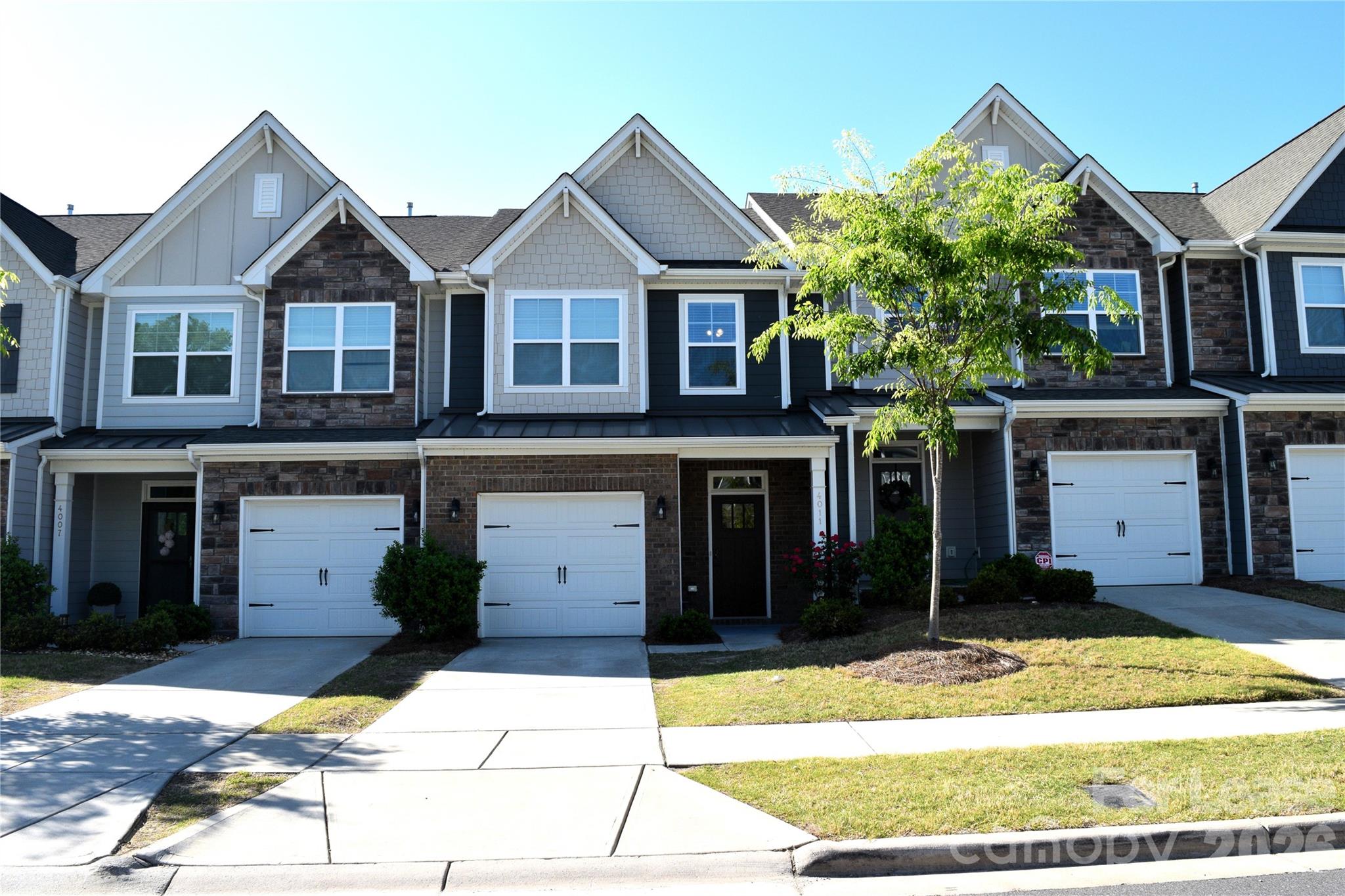 4011 Rothwood Lane Harrisburg, NC 28075 - Photo 2 of 29 a front view of a house with a yard