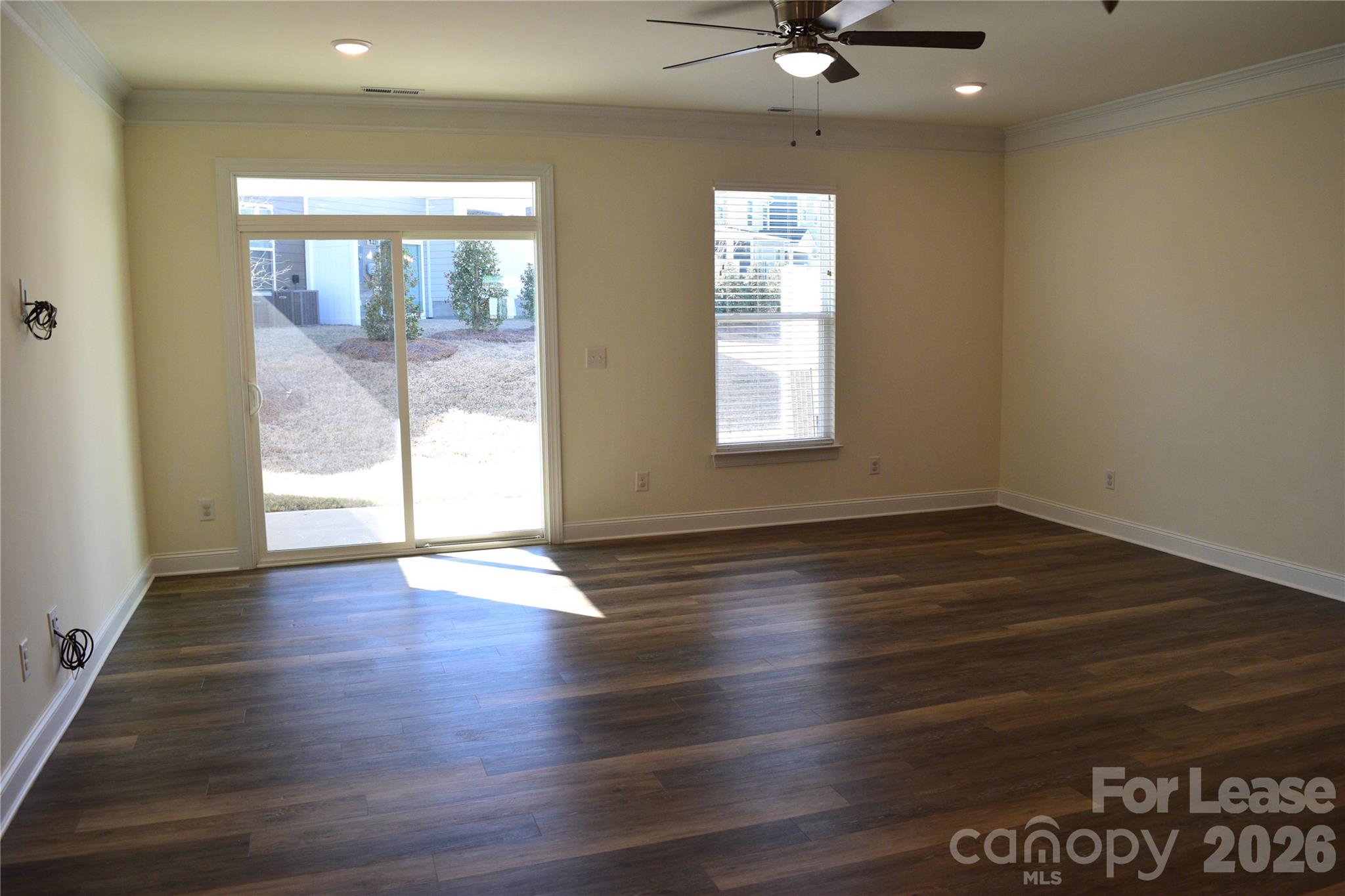 4011 Rothwood Lane Harrisburg, NC 28075 - Photo 10 of 29 an empty room with wooden floor and windows