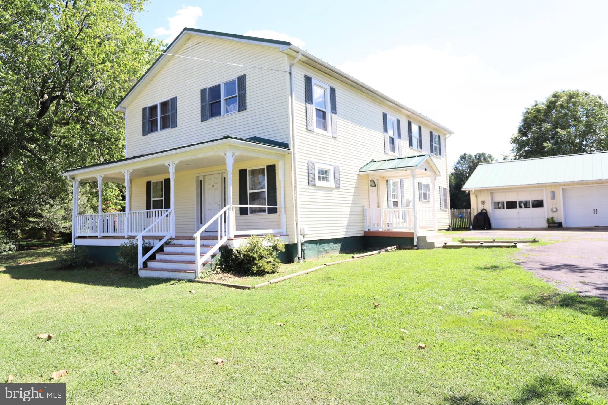 23202 Village Road Unionville, VA 22567 - Photo 23 of 28 a front view of a house with a yard
