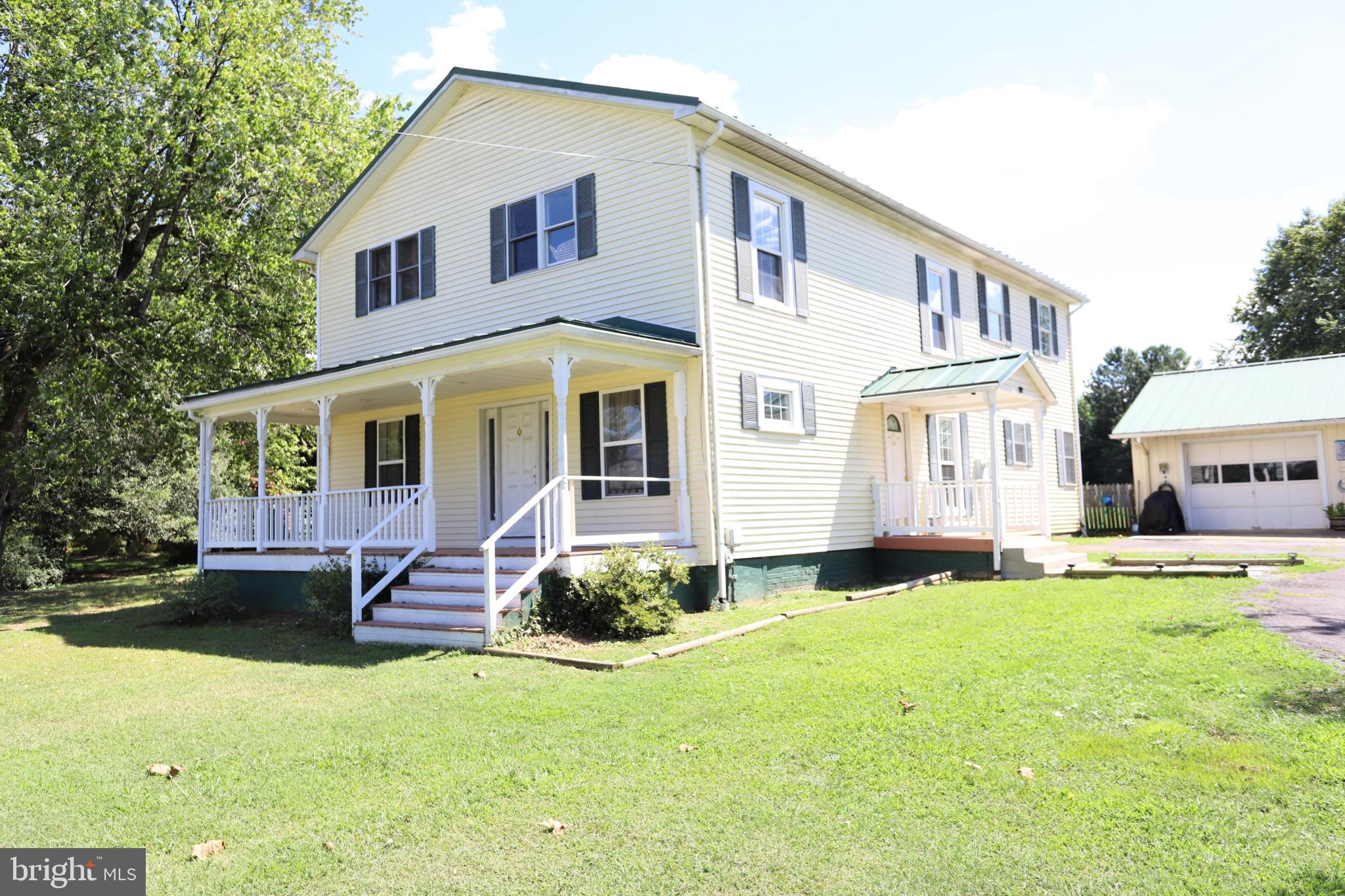 23202 Village Road Unionville, VA 22567 - Photo 24 of 28 a front view of a house with a yard