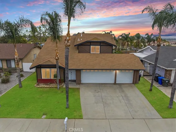 an aerial view of a house with a garden