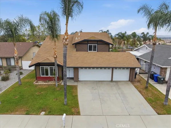 an aerial view of a house with a garden