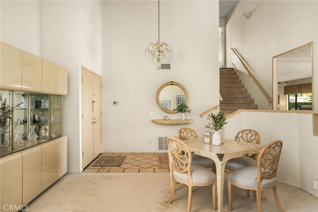 2927 Treeview Place Fullerton, CA 92835 - Photo 14 of 62 a view of a dining room with furniture and chandelier