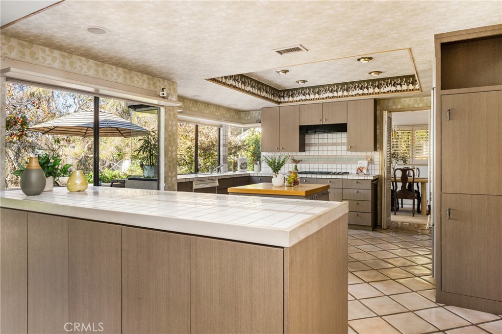 2927 Treeview Place Fullerton, CA 92835 - Photo 23 of 62 a view of a kitchen with a sink and refrigerator