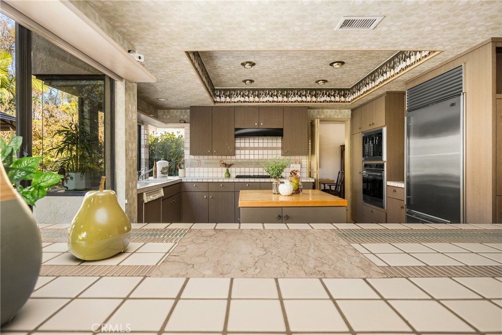2927 Treeview Place Fullerton, CA 92835 - Photo 24 of 62 a view of a hallway with a chandelier and living room