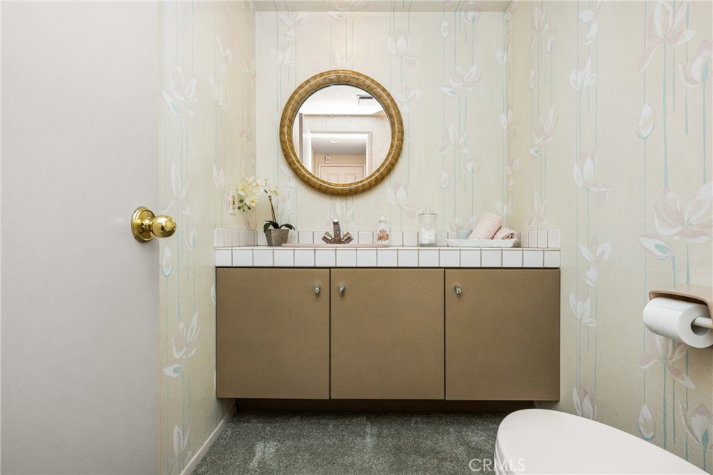2927 Treeview Place Fullerton, CA 92835 - Photo 29 of 62 a bathroom with a sink and a mirror