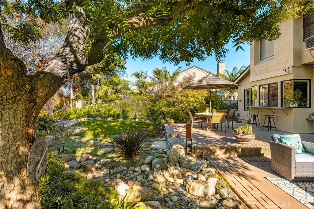 2927 Treeview Place Fullerton, CA 92835 - Photo 35 of 62 a view of a patio with table and chairs under an umbrella