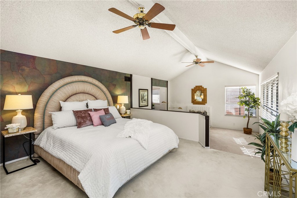 2927 Treeview Place Fullerton, CA 92835 - Photo 47 of 62 a bedroom with a large bed and a chandelier