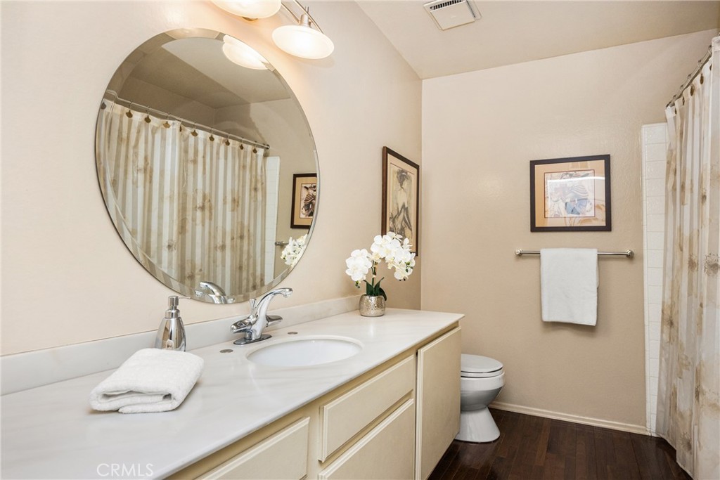 2927 Treeview Place Fullerton, CA 92835 - Photo 53 of 62 a bathroom with a double vanity sink and a mirror
