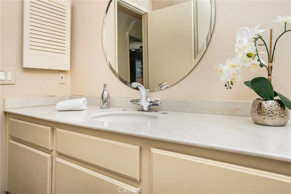 2927 Treeview Place Fullerton, CA 92835 - Photo 55 of 62 a bathroom with a sink and a mirror