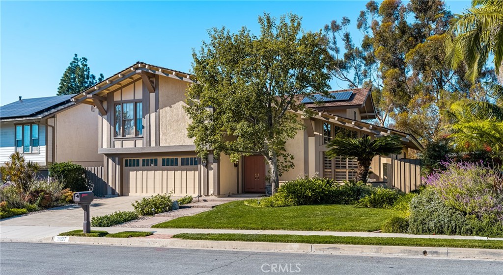 2927 Treeview Place Fullerton, CA 92835 - Photo 62 of 62 a front view of a house with a yard and potted plants