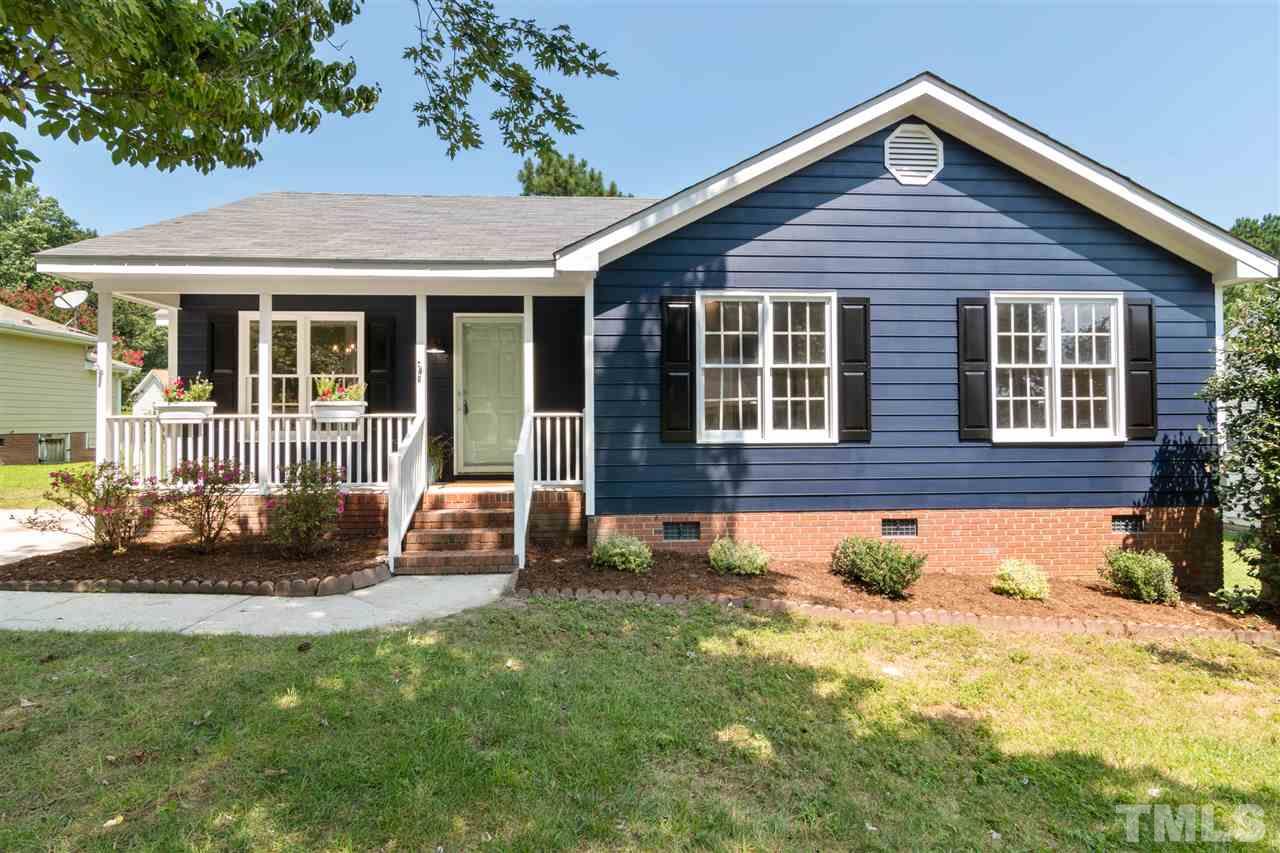 3324 Castlegate Drive Raleigh, NC 27616 - Photo 1 of 26 a front view of a house with a yard