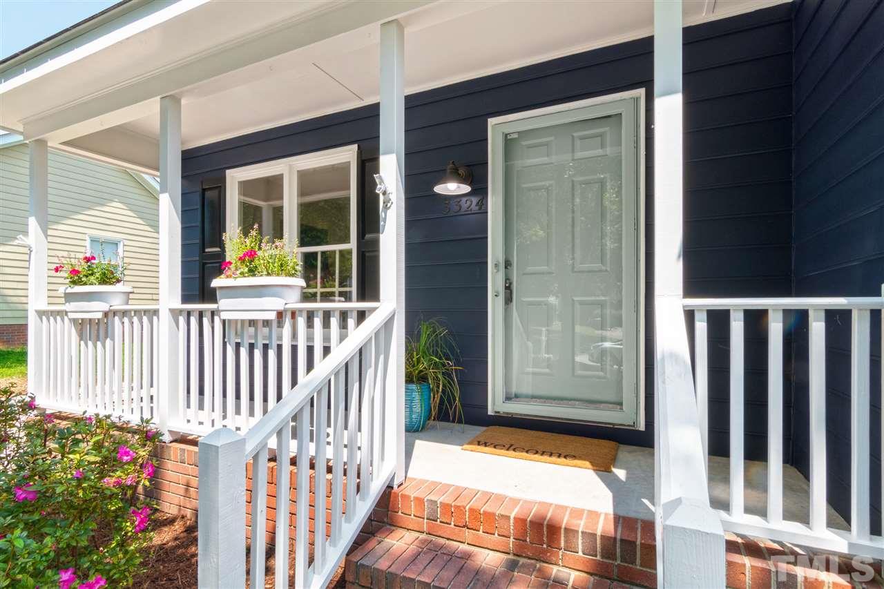 3324 Castlegate Drive Raleigh, NC 27616 - Photo 3 of 26 a view of porch with small garden