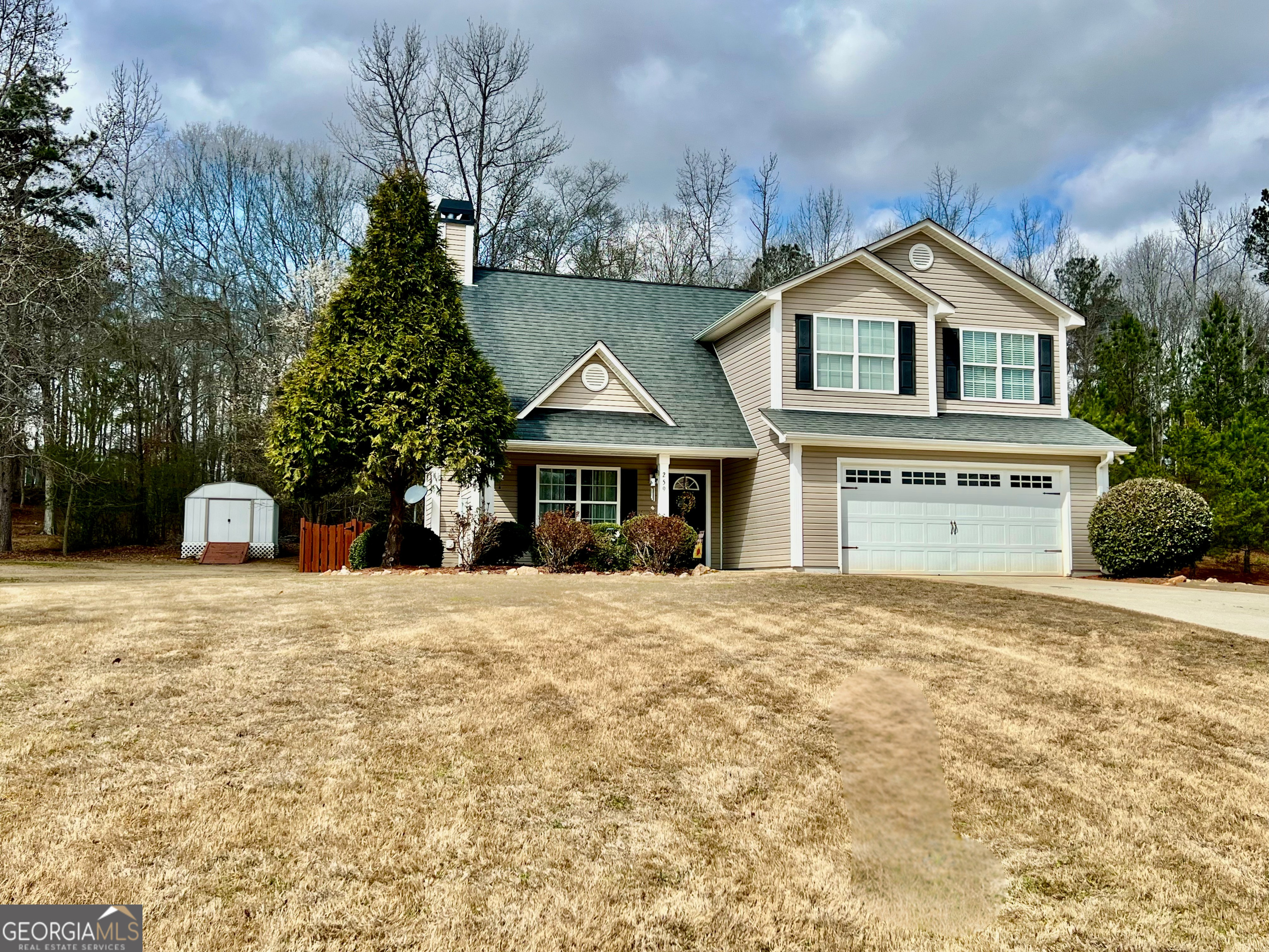 259 Watson Drive Hull, GA 30646 - Photo 1 of 47 a front view of a house with a yard and garage