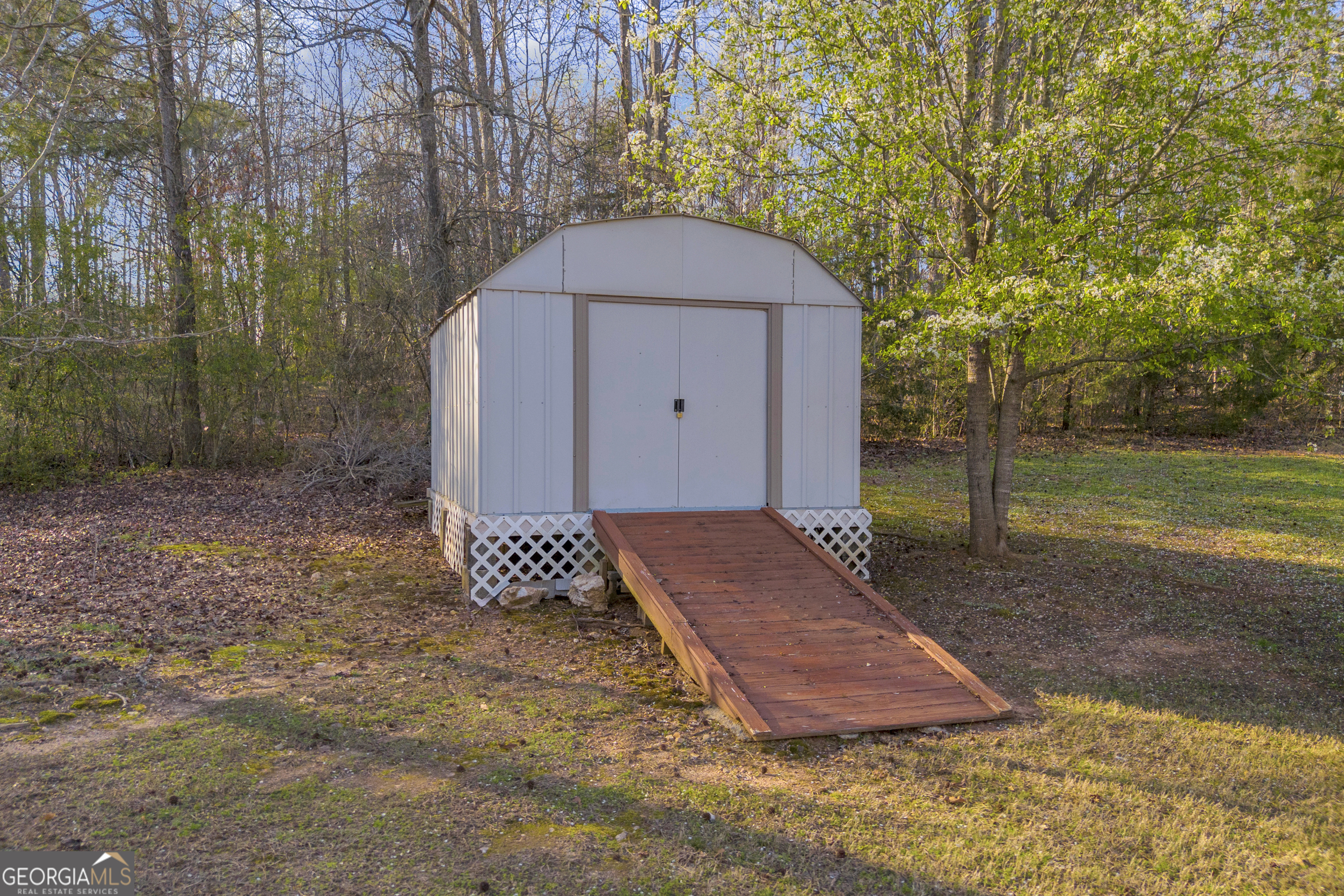 259 Watson Drive Hull, GA 30646 - Photo 14 of 47 a view of a backyard with large trees