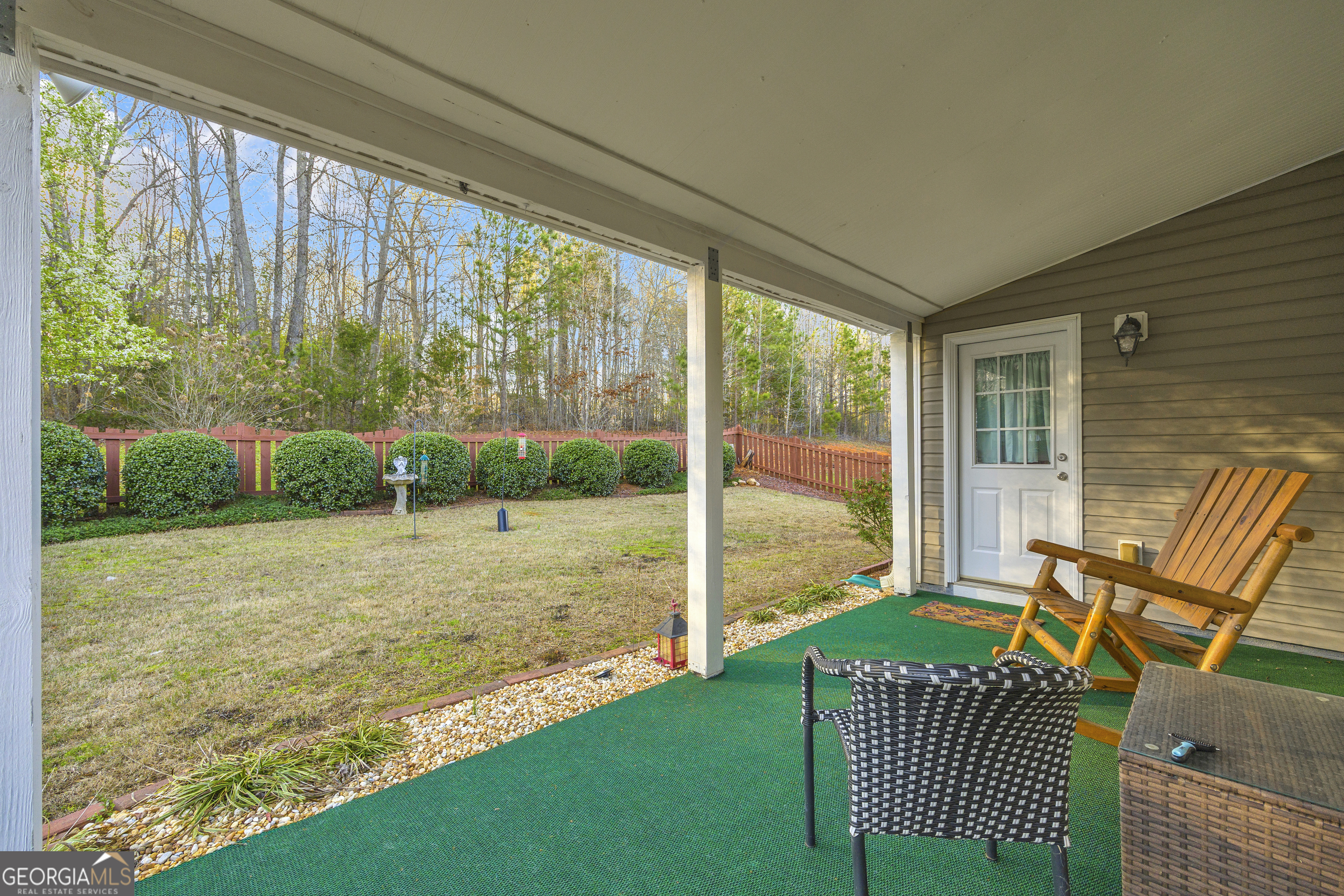 259 Watson Drive Hull, GA 30646 - Photo 17 of 47 a living room with a yard table and chairs