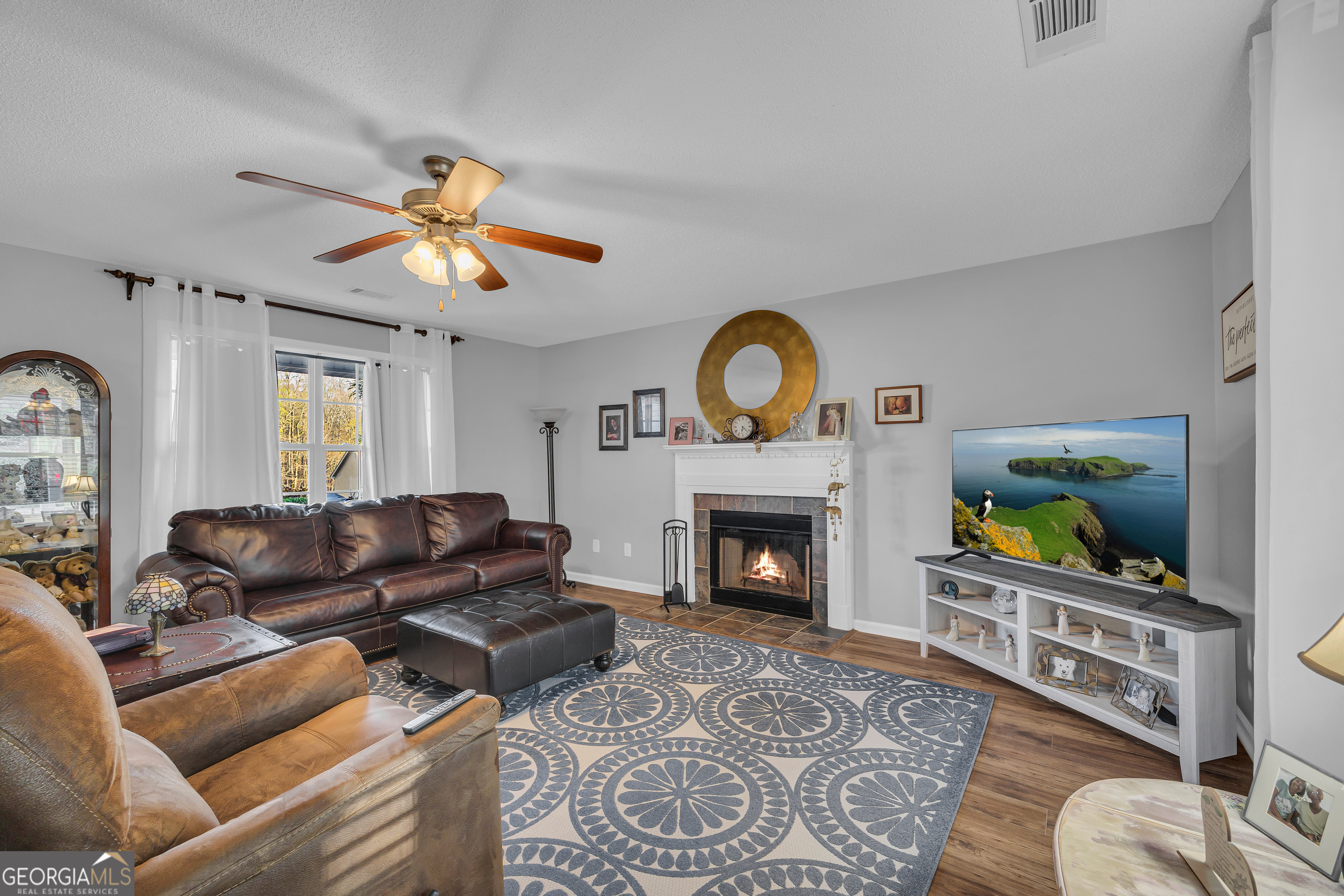 259 Watson Drive Hull, GA 30646 - Photo 23 of 47 a living room with furniture and a fireplace