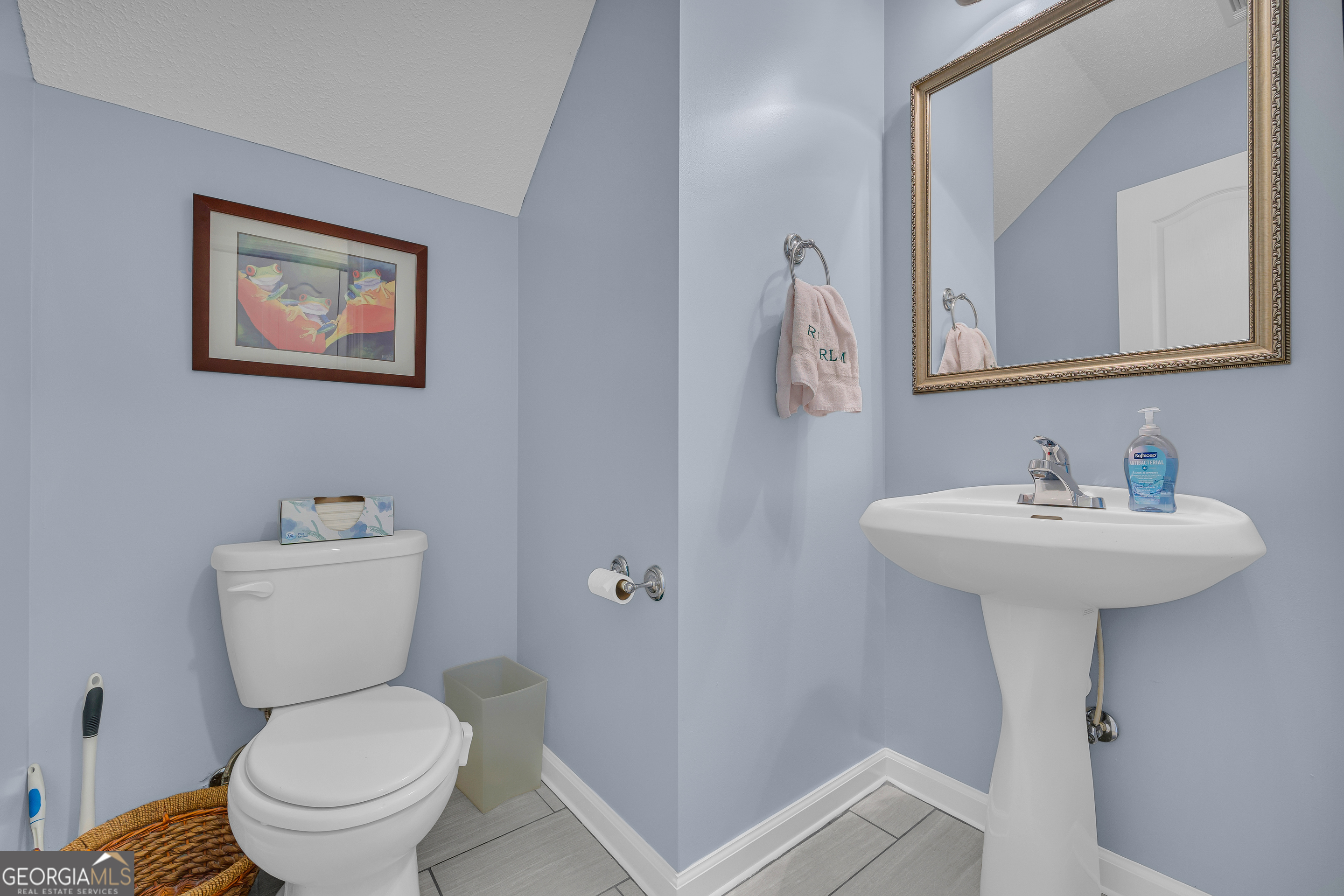 259 Watson Drive Hull, GA 30646 - Photo 32 of 47 a bathroom with a toilet sink and mirror