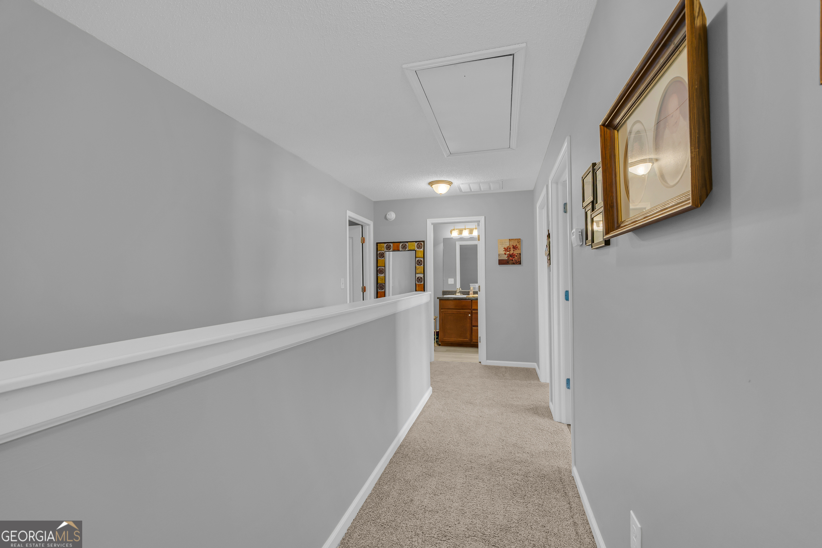 259 Watson Drive Hull, GA 30646 - Photo 34 of 47 a view of a hallway with wooden floor and staircase