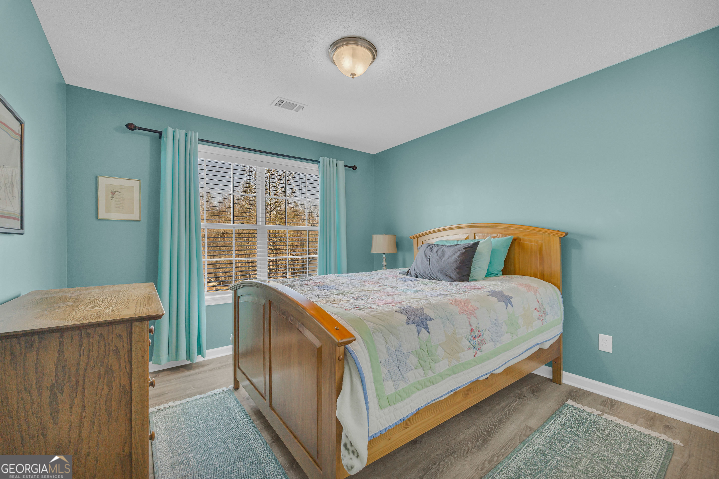 259 Watson Drive Hull, GA 30646 - Photo 42 of 47 a bedroom with a bed and a window