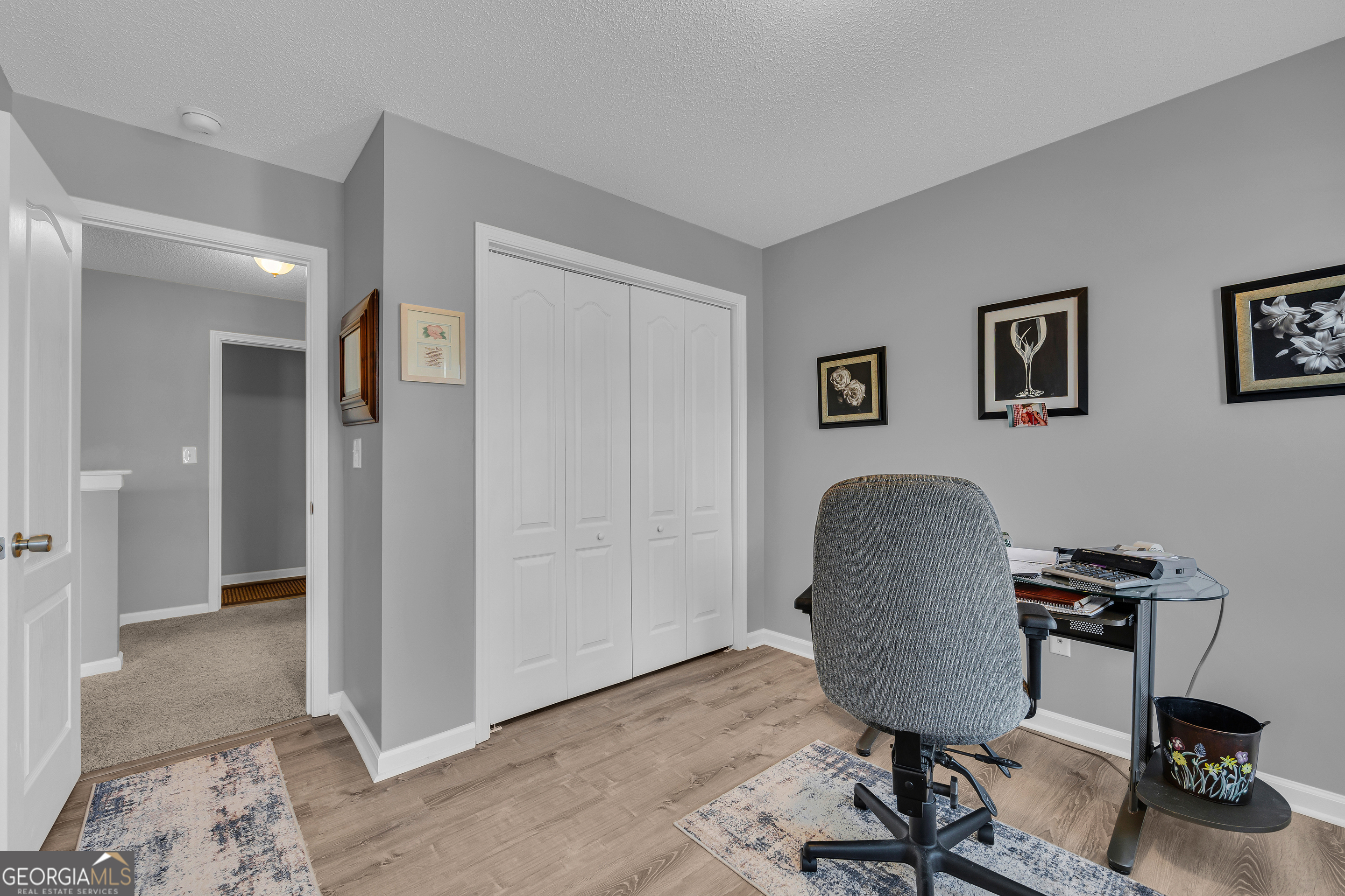 259 Watson Drive Hull, GA 30646 - Photo 44 of 47 a view of a workspace with furniture and a livingroom