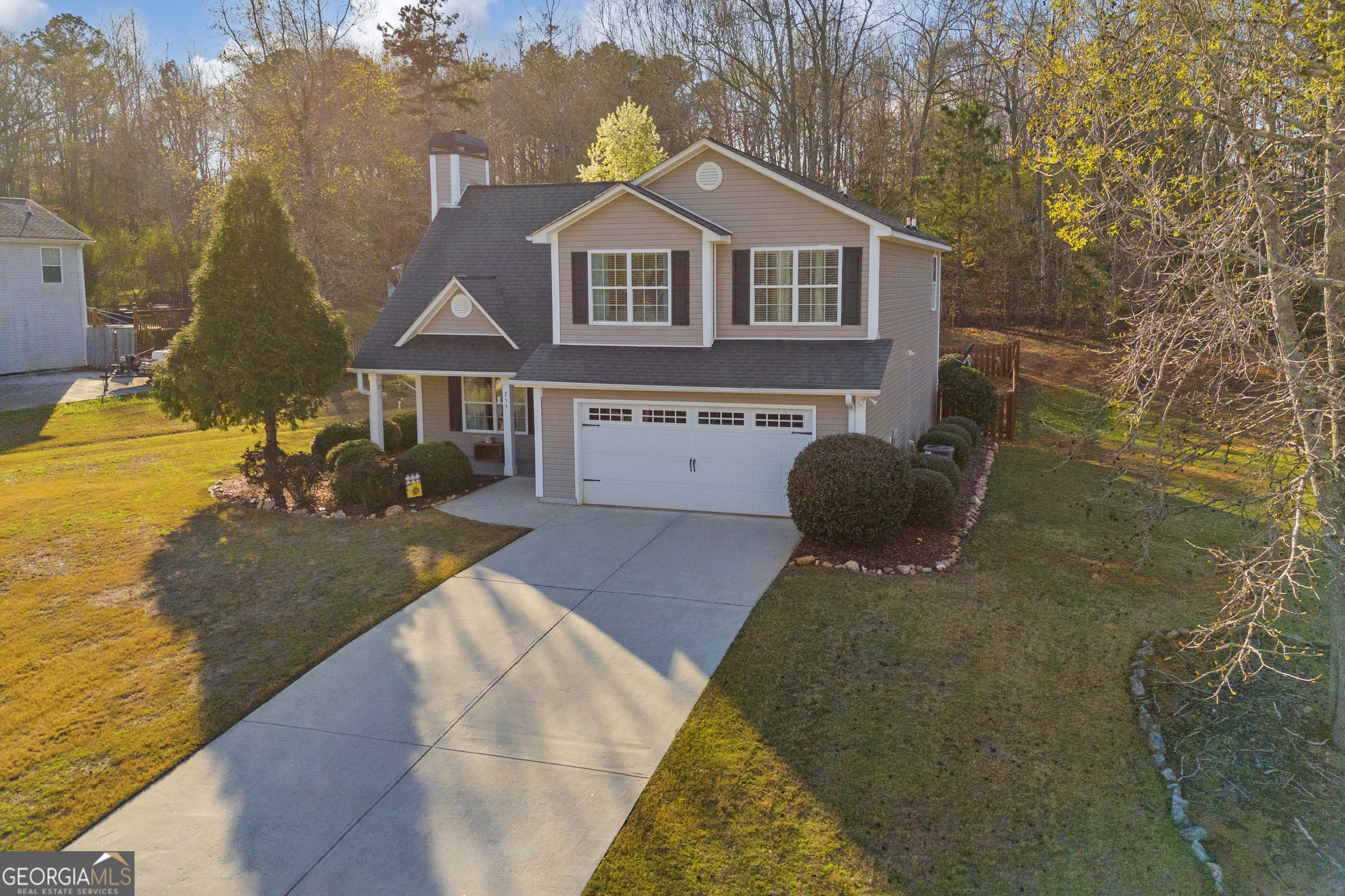 259 Watson Drive Hull, GA 30646 - Photo 9 of 47 a front view of a house with a yard and garage