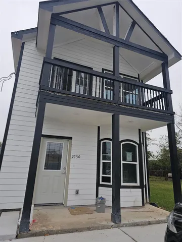 a front view of a house with a porch