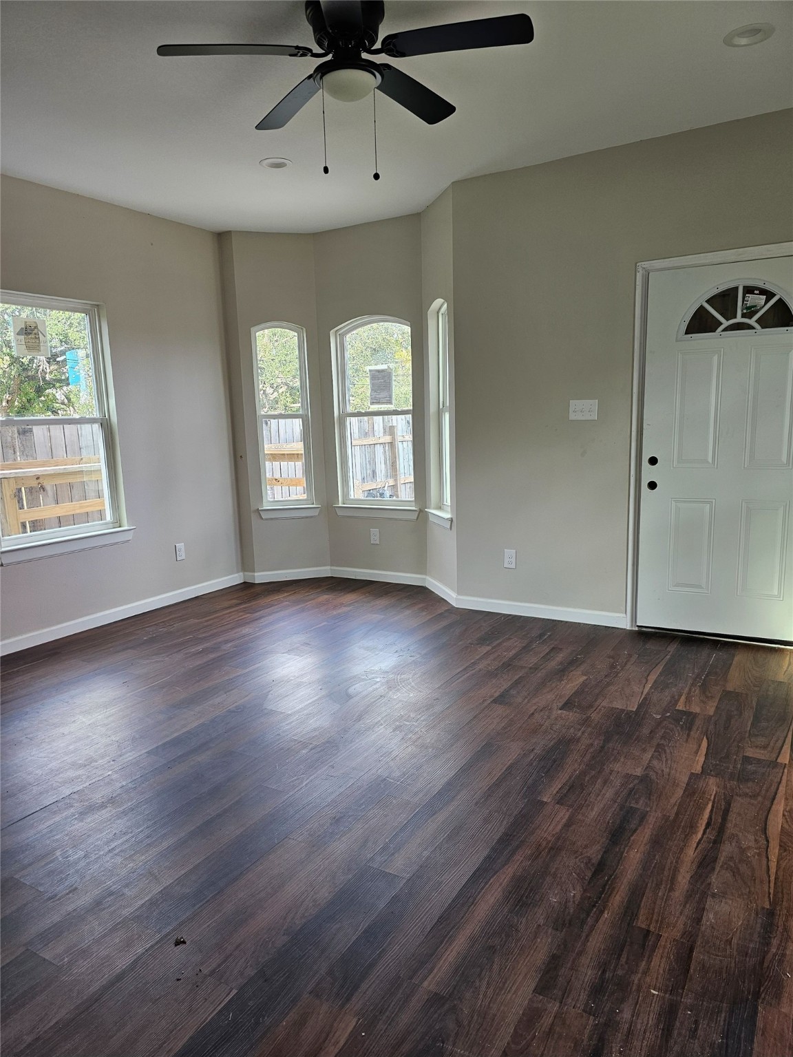 9730 Kerr Street Houston, TX 77029 - Photo 5 of 9 a view of an empty room with wooden floor and a window