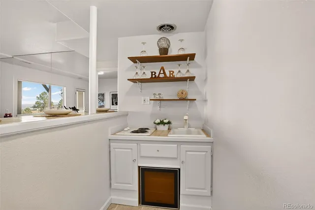 a bedroom with a bed and chair