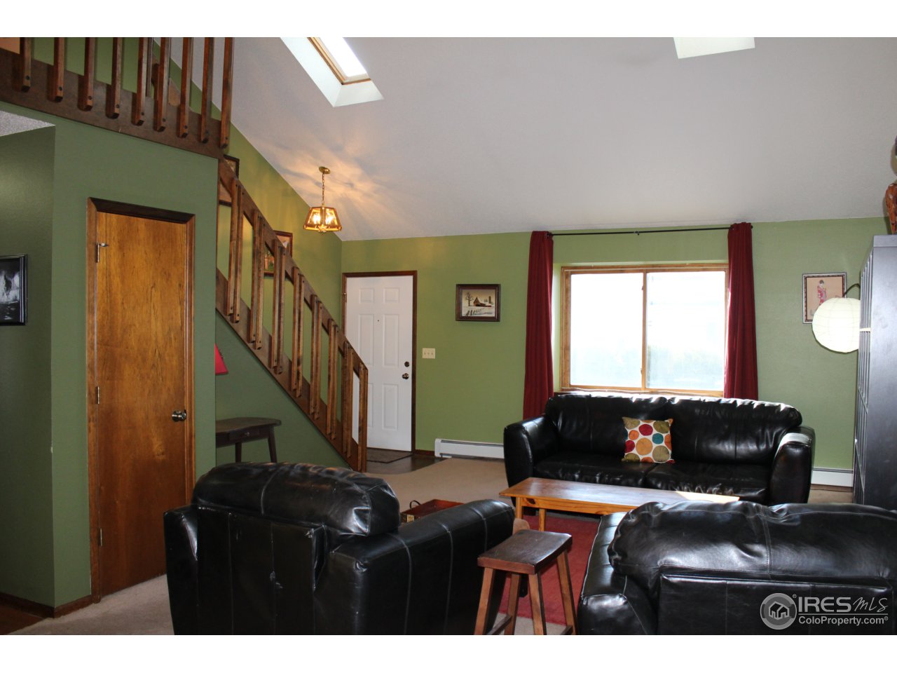 4833 West 6th Street Road Greeley, CO 80634 - Photo 2 of 31 Living Room with Vaulted Ceiling & Skylights