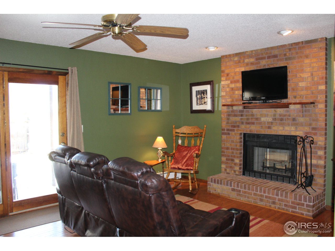 4833 West 6th Street Road Greeley, CO 80634 - Photo 7 of 31 Family Room with Wood Burning Fireplace