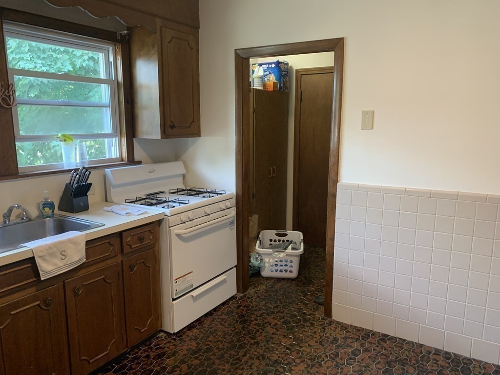 52 Winter Street, Unit 2 Medford, MA 02155 - Photo 12 of 15 a kitchen with a refrigerator and a stove