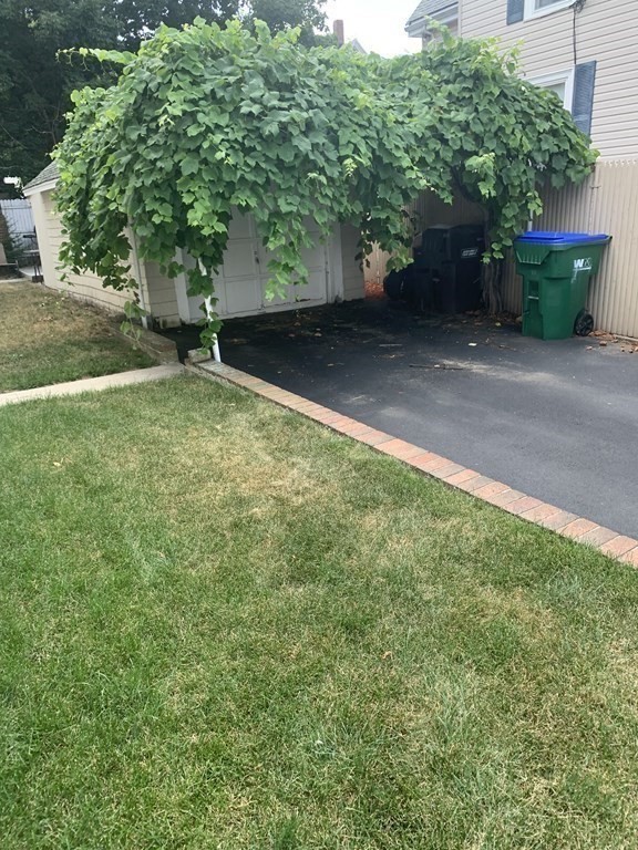 52 Winter Street, Unit 2 Medford, MA 02155 - Photo 15 of 15 a backyard of a house with lots of green space