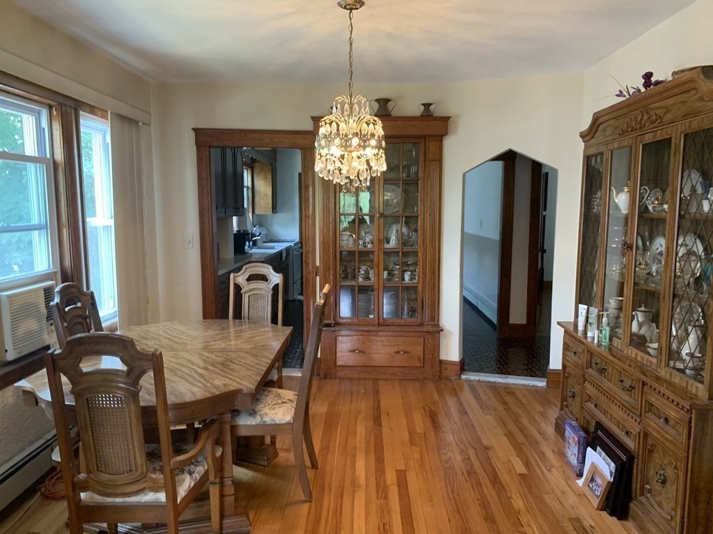 52 Winter Street, Unit 2 Medford, MA 02155 - Photo 3 of 15 a view of a dining room with furniture and chandelier