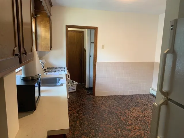 an empty room with wooden floor