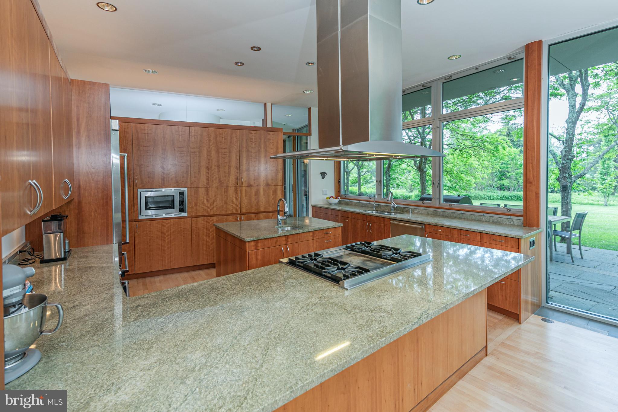 4750 Province Line Road Princeton, NJ 08540 - Photo 15 of 50 a kitchen with stainless steel appliances granite countertop a sink and a wooden floor