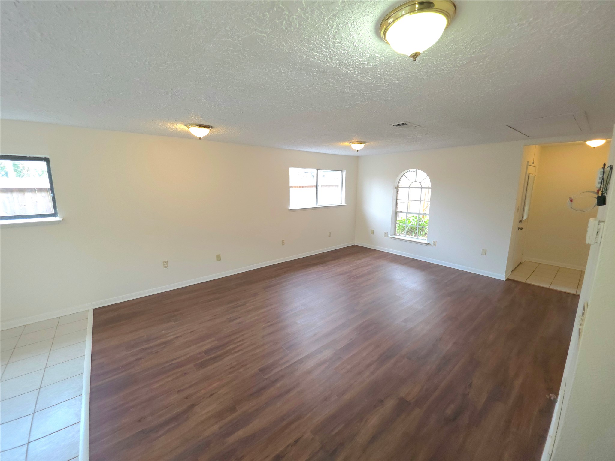 418 Texas Street Tomball, TX 77375 - Photo 16 of 23 This space features a living-room.