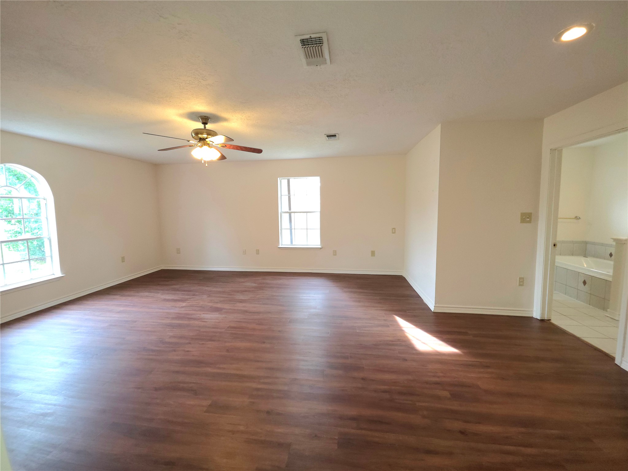 418 Texas Street Tomball, TX 77375 - Photo 2 of 23 This space features the primary bedroom.