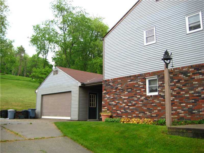 540 McCombs Road Venetia, PA 15367 - Photo 12 of 25 Exterior Back. Oversized garage with second floor storage, concrete driveway.