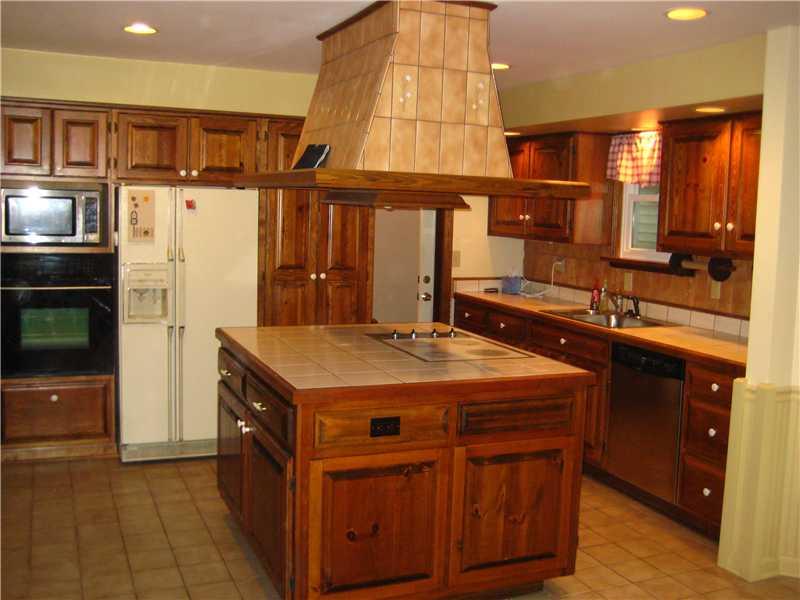 540 McCombs Road Venetia, PA 15367 - Photo 4 of 25 Kitchen. Custom gourmet eat-in kitchen with ceramic floors and countertops, custom storage for spices, wainscoting on walls.