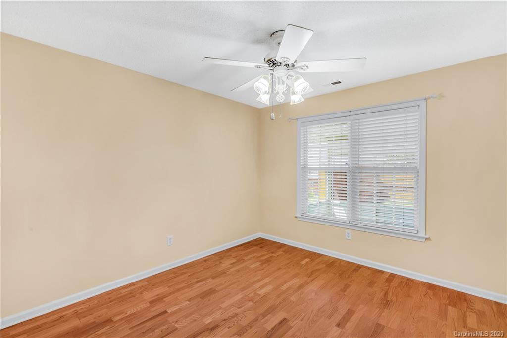 10 Farm Valley Road Fletcher, NC 28732 - Photo 11 of 29 a view of an empty room with wooden floor and a window