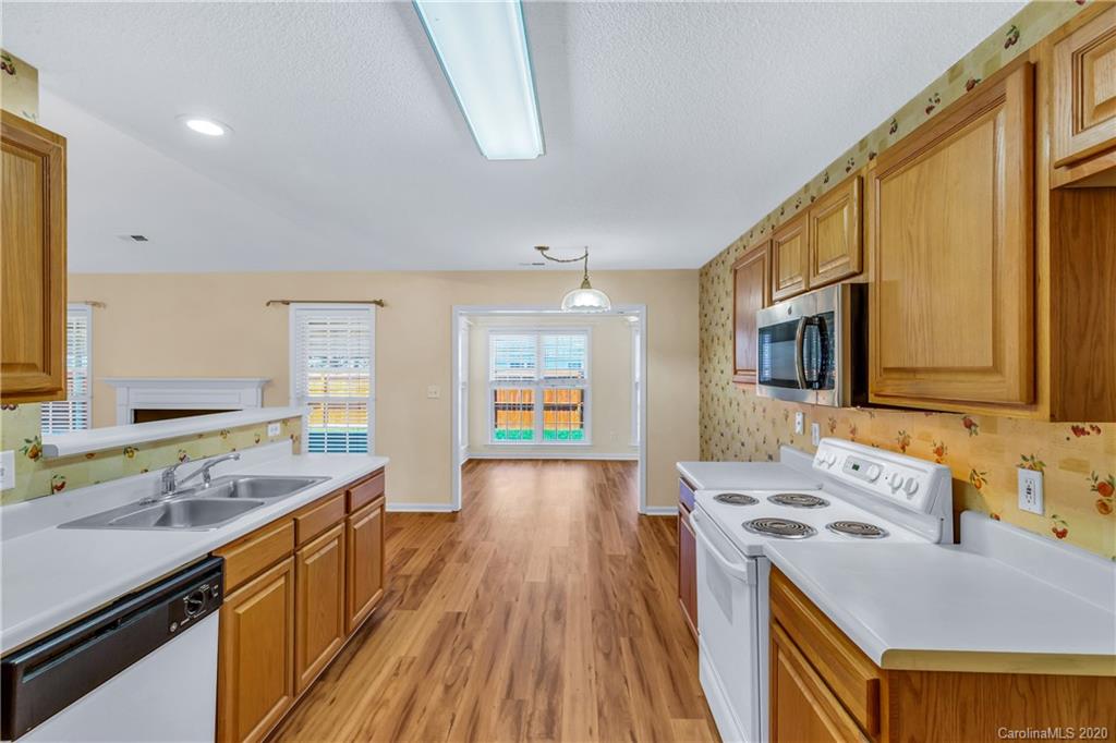 10 Farm Valley Road Fletcher, NC 28732 - Photo 4 of 29 a view of a kitchen with a sink and wooden floor