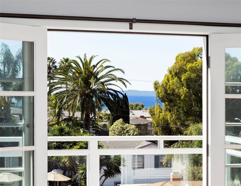 865 Fen Way Laguna Beach, CA 92651 - Photo 1 of 27 a view of a potted plant in front of a glass door
